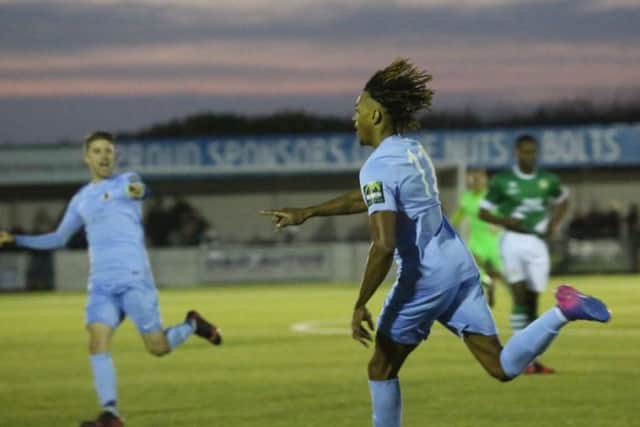 Horsham's match-winner Tyrell Richardson Brown reels away in celebration against Ashford United. Picture by John Lines