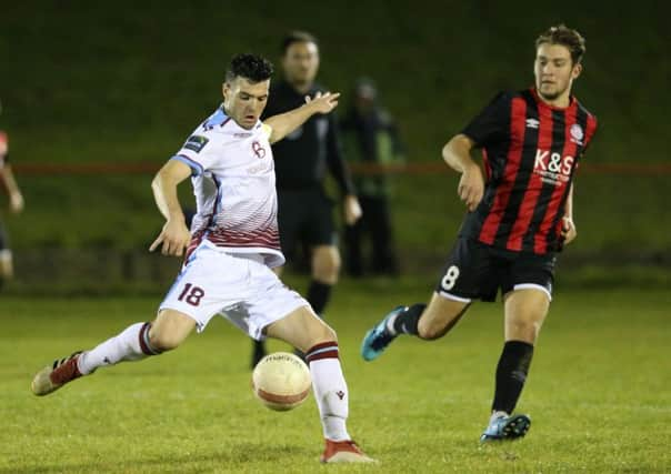 Jack Dixon shapes to strike the ball during Hastings United's 4-2 win away to Saltdean United last night. Pictures courtesy Scott White