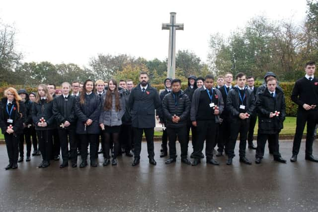 Planting of poppies at Hastings cemetery. Photo by Frank Copper. SUS-180111-154128001