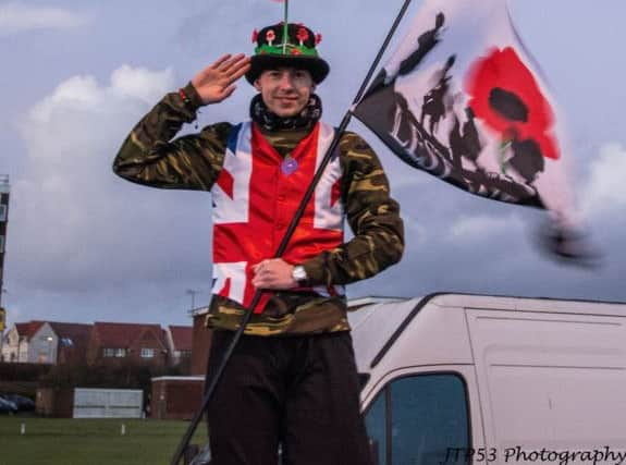 Bexhill's Shining Lights firework event. Mark Burford who marched around the event site on stilts in a great patriotic costume adorned with 100 poppies. Photo by Jeff Penfold. SUS-181114-094142001