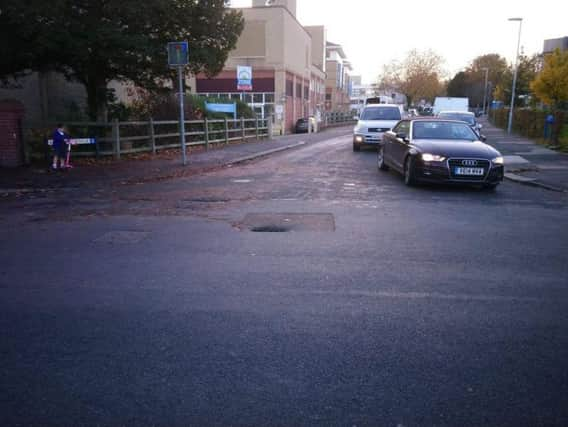 Crews are attending a sinkhole on Homefield Road near Park Avenue in Worthing. Picture: NSL