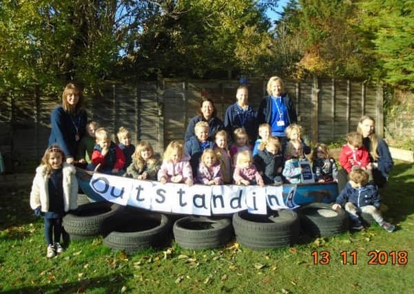 Pupils and staff at St Gregory's Montessori Nursery School celebrating after the 'Oustanding' Ofsted result