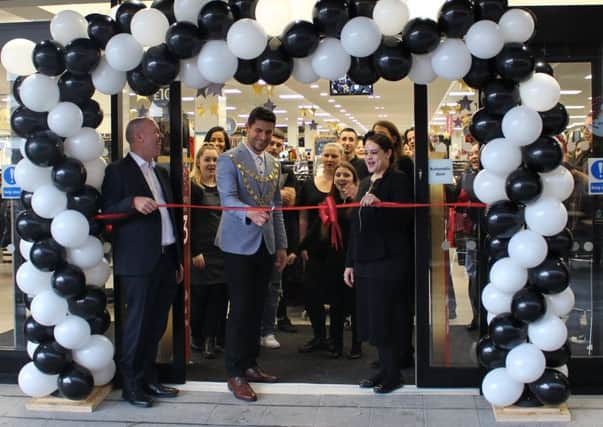 The Mayor of Crawley, Councillor Carlos Castro, and regional manager of Peacocks Les McLain open the new store