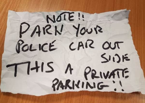 Note shared by officers on social media after being left on police car. Photo by Reigate and Banstead Beat