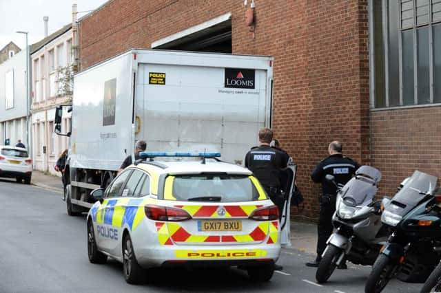 Police at the scene of an armed robbery at Brighton and Hove Bus depot, Conway Street, Hove. Picture by Allan Hutchings SUS-181120-161712001