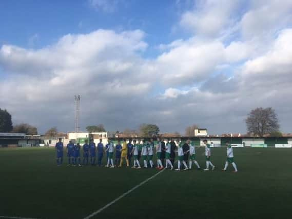 The teams line up before the game