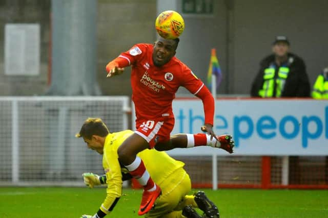 Dom Poleon is brought down by Crewe 'keeper Ben Garratt for the penalty. Picture by Steve Robards.