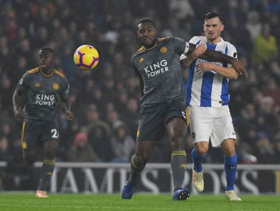 Pascal Gross battles for the ball with Leicester captain Wes Morgan. Picture by PW Sporting Photography