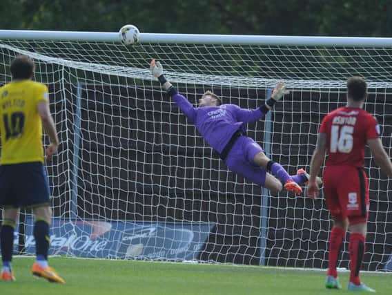 Freddie Woodman in action for Crawley Town against Oxford United