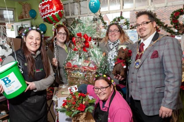 Mayor Billy Blanchard-Cooper, right, at The Flower Shop