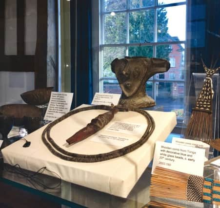 A collection of Pacific ethnographical objects framed against Horshams Causeway. SUS-181012-114556001