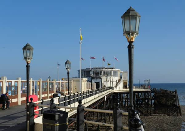 Worthing Pier was built in 1862, wrecked in a violent storm in 1913 and all but burnt down in 1933, then cut in half in 1940, but still stands proud. Picture: Derek Martin D14161606a