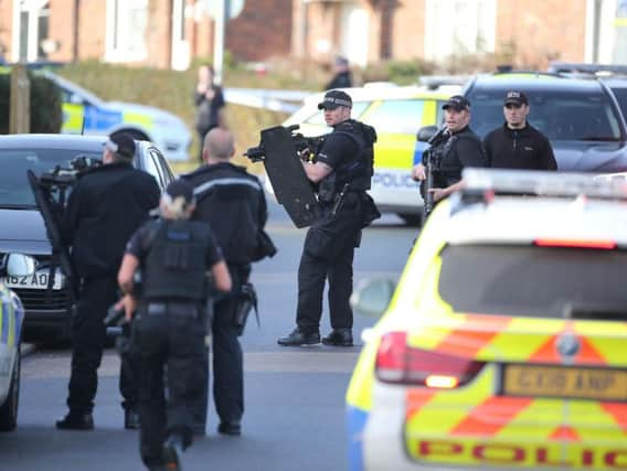 Armed police on scene, photo by Eddie Mitchell