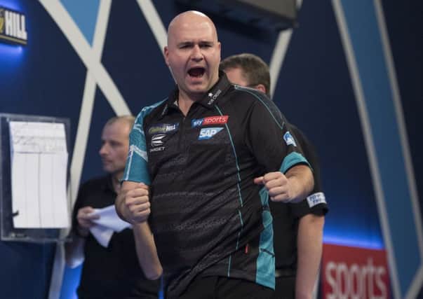 Rob Cross celebrates during his second round victory over Jeffrey De Zwaan. Picture courtesy Lawrence Lustig/PDC