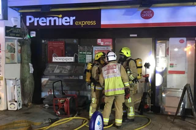 Firefighters tackling the blaze at the shop