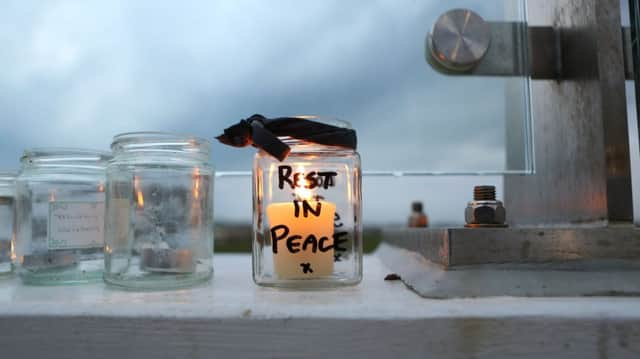 The Bridge of Light in memory of the Shoreham Airshow crash victims. An RIP candle is left. SUS-181224-111720001