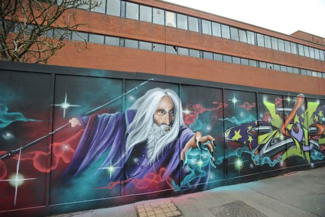 Decorative graffiti on boards in Moy Avenue (Photo by Jon Rigby)