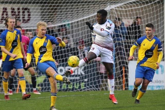 Daniel Ajakaiye gets his foot to the ball ahead of an opponent during Hastings United's 5-0 win at home to Sittingbourne last weekend. Picture courtesy Scott White