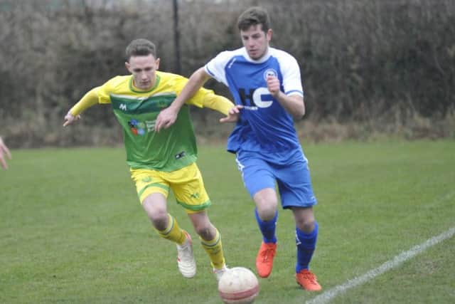 Jordan Harley tracks the Roffey player in possession