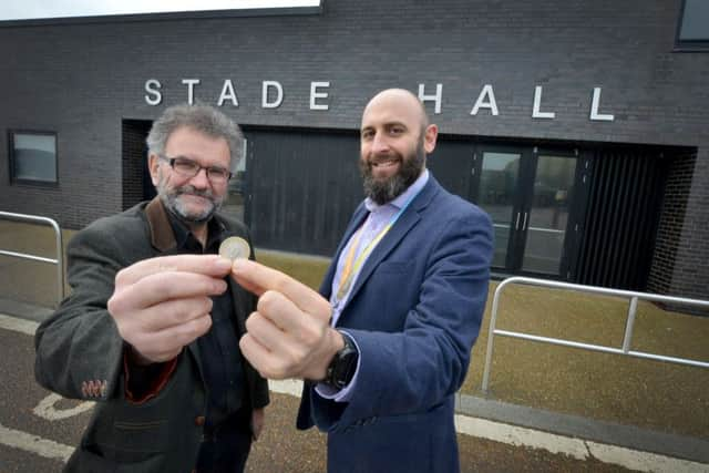 Cllr Peter Chowney and Dan Shelley holding £2  the ground rent that the college has paid for the next two years