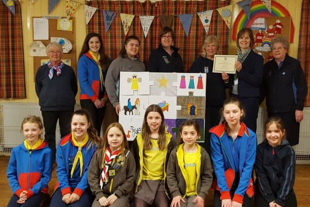 3rd Haywards Heath Guides and Lions carolling at the railway station