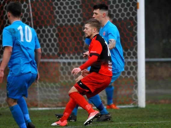 Phil Johnson in action against Arundel on Saturday. Picture by Steve Robards