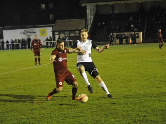 Action from Alfold's 1-0 win at Bexhil United in Division 1 action earlier this month. Picture by Simon Newstead