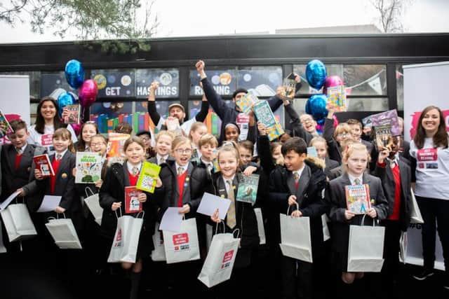 The launch of Get Hastings Reading. Children from Ark Little Ridge Primary Academy receive free books to take home. Photo by Caitlin Lock. SUS-190130-141817001