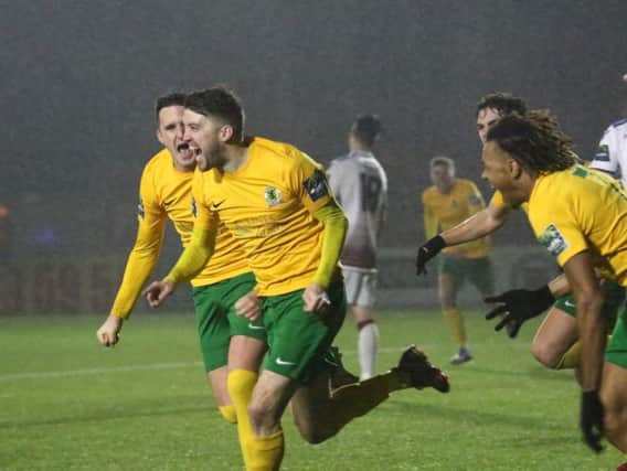 Horsham v Hastings United. Steve Metcalf is chased by his team-mates having scored in injury-time. Picture by John Lines