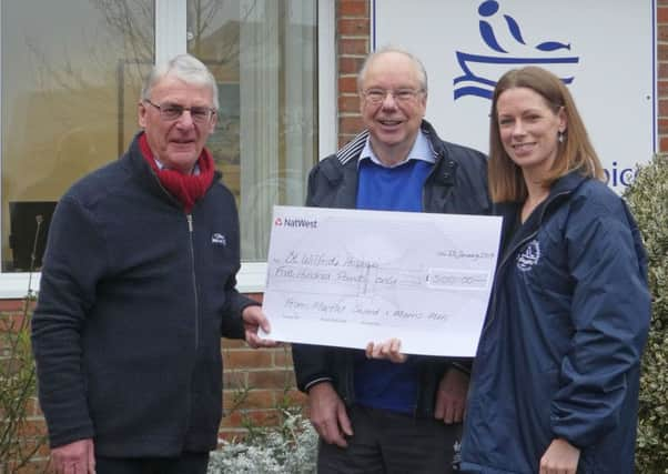 David Asher, Pete Davey and Alex Burch presenting the cheque