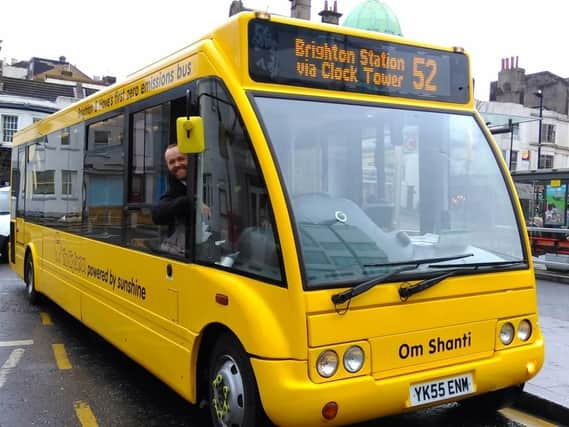 Tom Druitt driving one of The Big Lemon's electric buses