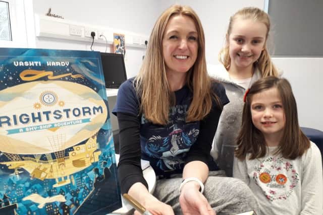 Author Vashti Hardy with pupils at a Brightstorm book signing