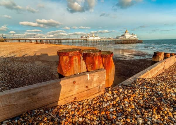 Eastbourne pier and beach at the golden hour before sun goes down on a cold but bright day in winter, by Lorraine Meltzer. Taken with an iPad. SUS-190702-094339001