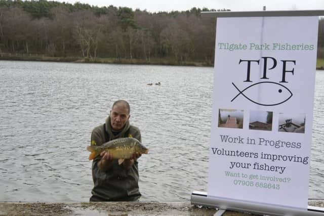 Restocking the fishing lakes at Tilgate Park