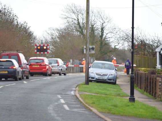 The level crossing barrier at Pevensey Bay is stuck down (Photograph: Dan Jessup)