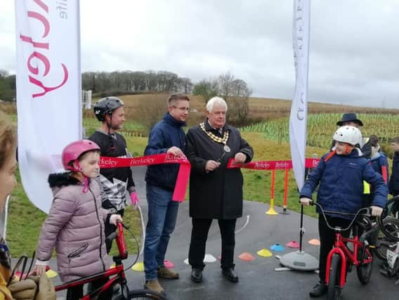 Councillor Burgess cut the ribbon