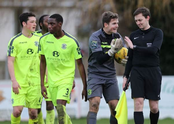 Hastings United protest against the decision to allow Whitstable Town's equaliser to stand. Picture courtesy Scott White