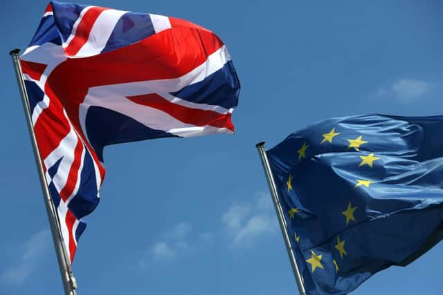 A British Union Jack and European Union flag fly