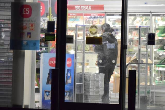 Officers at the scene. Photo by Dan Jessup