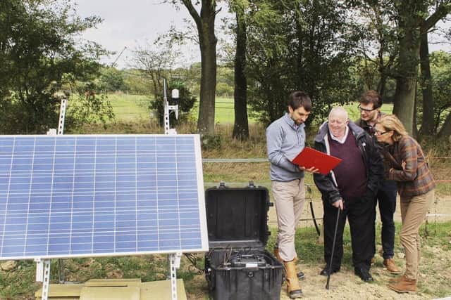 MEP Keith Taylor with seismologist Dr Stephen Hicks and local oil campaigner Vicki Elcoate with an earthquake monitor installed in Surrey  in 2018 SUS-190218-120526001