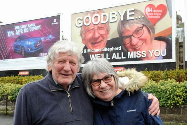 Tan and Michael Shepherd in front of the billboard dedicated to them. Picture: Kate Shemilt ks190080-1