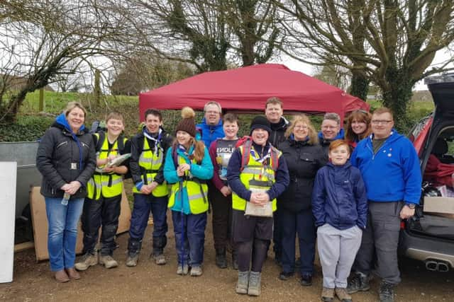 From left: Treasurer Tracy Scholfield, chairman Steve Lewsey, secretary Mark Scholfield, assistant scout leader Dawn Sullivan, quartermaster Gary Sullivan, assistant cub and scout leader, Cathy Lewsey and group scout leader Mike Gurr with some of the scouts