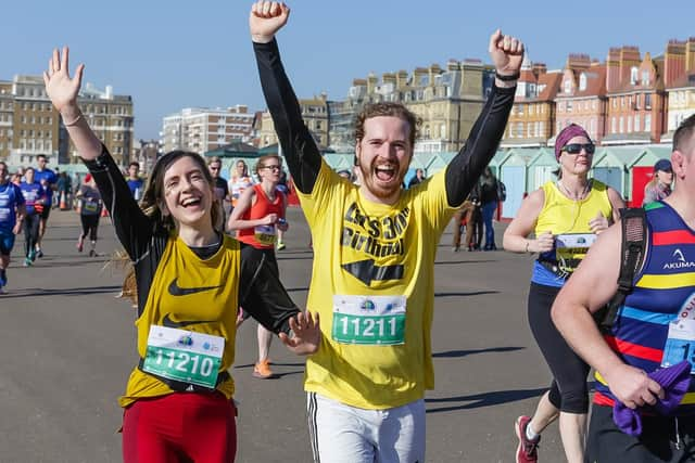 Runners in good spirits as they make their way past Hove beach huts (Photograph: The Grand Brighton Half Marathon)