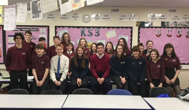 Huw Merriman with students at Robertsbridge Community College SUS-190225-100949001