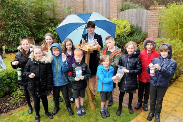 Year three and six pupils with Pina Masella, sales adviser