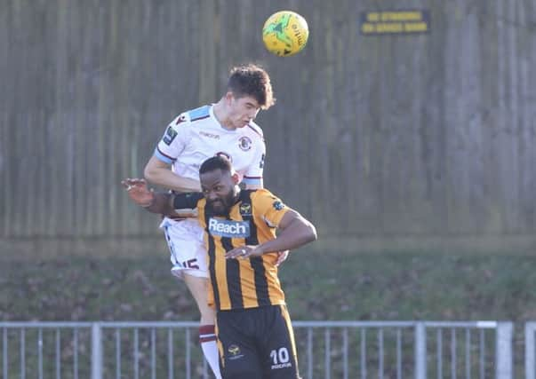 Jamie Fielding wins a header during Hastings United's 2-1 defeat away to East Grinstead Town last weekend. Picture courtesy Scott White