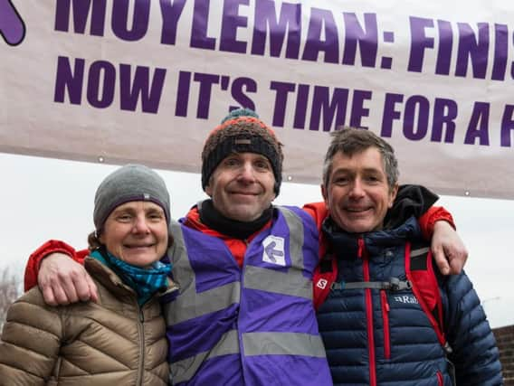 Helen Sida, race director Duncan Rawson and Lewis Sida at last year's marathon. Photograph: Barry Collins