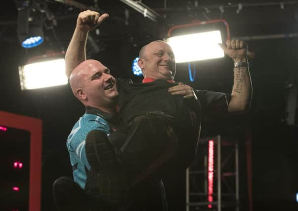 Rob Cross holds Darren Webster aloft LADBROKES UK OPEN 2019  BUTLINS RESORT  MINEHEAD  PIC LAWRENCE LUSTIG  ROUND 4  Rob CROSS V DARREN WEBSTER ROB CROSS holds Webster aloft after their fourth round match on Friday night