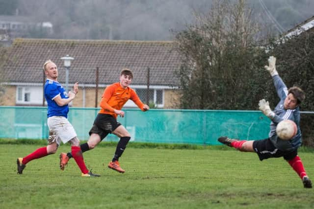 Mile Oak's Joseph Benn finds the back of the net against Littlehampton Town. Picture: David Jeffery