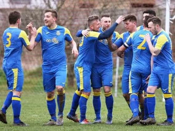 Rustington celebrate a goal in the win over Angmering Seniors. Picture: Derek Martin